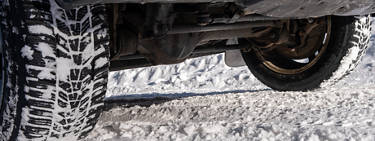 An image of a the front differential of a four-wheel drive vehicle and its tires.