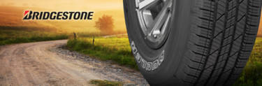 Bridgestone exclusive tire: Dueler LX on a dirt road