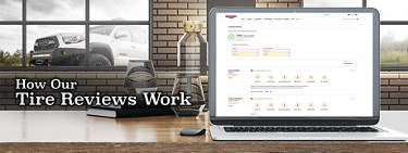 Discount Tire reviews are shown on a laptop in an office with a Toyota in the background window