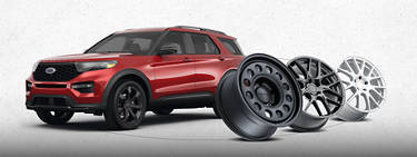 An image of a red vehicle on the left with three rims on the right side.