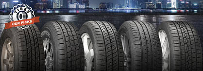 An image of a variety of tires in the foreground with a rainy city at night in the background and on the left are the words 'Tires: Our Picks.'