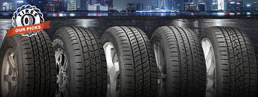 An image of a variety of tires in the foreground with a rainy city at night in the background and on the left are the words 'Tires: Our Picks.'