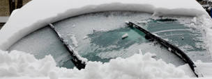 wipers clearing a snowy windshield