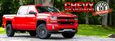 Red Chevy Silverado with all terrain tires