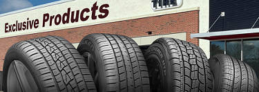 exclusive tires at Discount Tire in a line sitting in front of a store