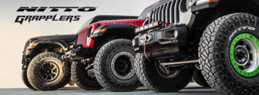 Nitto Grappler wheels on multiple vehicles lined up with the words, 'Nitto Grapplers' written in the top corner.