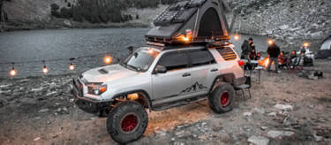 Toyota 4runner overlanding next to a small pond