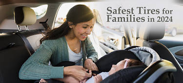mother buckling her baby into a car seat