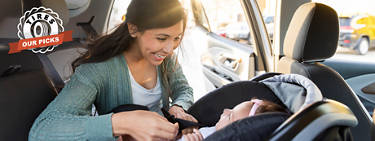 A mother buckling her baby into a car seat with the 'Tires: Our Picks' logo to the left.