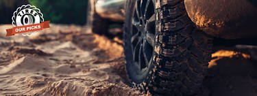 An image of a truck doing through muddy terrain with the words and tire insignia of 'Tires: Our Picks' to the left.