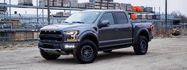 An image of a truck in front of a construction site.