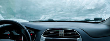An image of a foggy windshield from the inside of the vehicle.