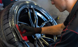 Tire technician servicing a tire