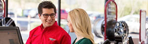 Customer being served by an associate at Discount Tire