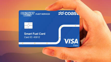 Discount Tire Fleet Services Coast card in hand