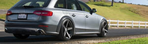 Audi hatchback sitting on a country road