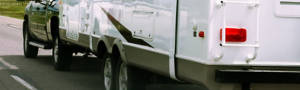 Truck pulling an overloaded trailer