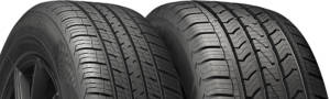 Two tires of different sizes sitting side by side