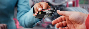 discount tire credit card handed to a person