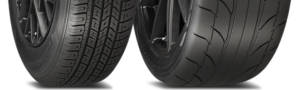 Two tires of different widths and diameters sitting next to one another