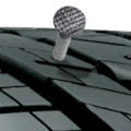 Tire tread with a nail stuck into it