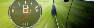 Fuel gauge on 'full' with a car traveling fast through grass