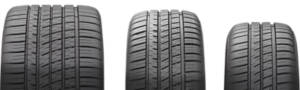 Closeup of three tires of different sizes
