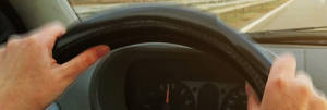 Car drivers hands vibrating as they drive