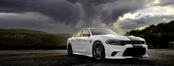 White sports car featuring summer tires