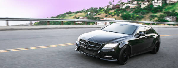 Black Mercedes featuring touring tires