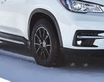 Snow/Winter Tires on a car driving through snow
