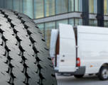 Commerical tire with a commercial van in the background