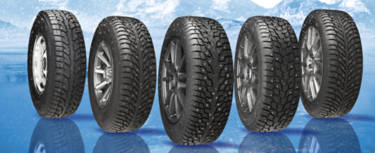 Studded winter tires sitting side by side