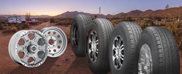 Trailer on a dirt road with an assortment of trailer tires and wheels