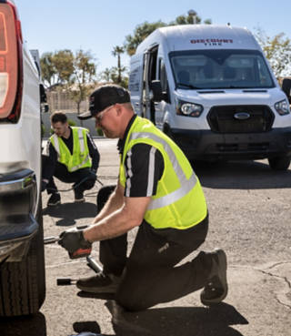 fleet techs tightening lugs on a truck