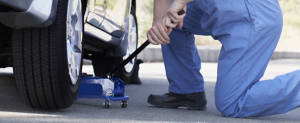 Man preparing to change a tire