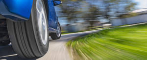 Car tire traveling around a turn