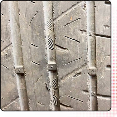 An image of a tire with low tread