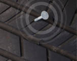 Nail puncturing a tire