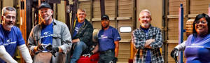Cooper Tire manufacturing employees posed in a factory