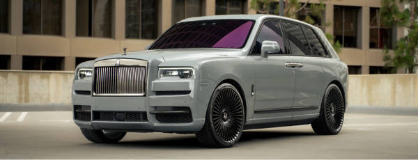 Luxury SUV parked on the curb with a set of Dolce Luxury wheels.