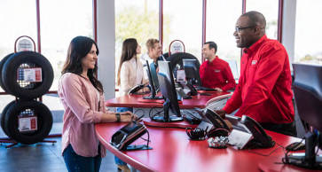 Customers and employees in a America's Tire store