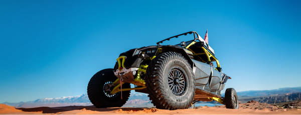 ATV driving on dirt road