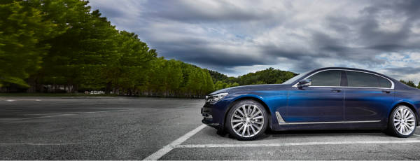 Blue coupe sporting Kumho tires