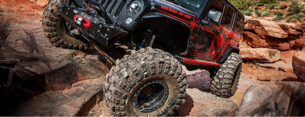 ATV driving on boulders featuring Mickey Thompson tires