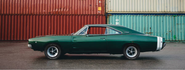 Classic Dodge Charger parked on the street with Pro-Trac Classics Street Pro III tires.