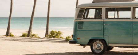 summer beach scene with a VW bus