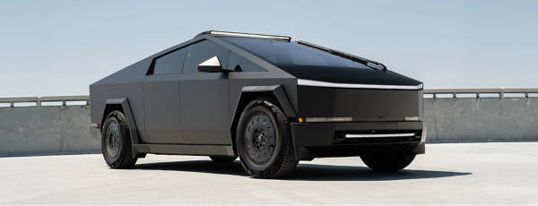 Tesla Cybertruck parked on the roof of a parking garage with T Sportline wheels.