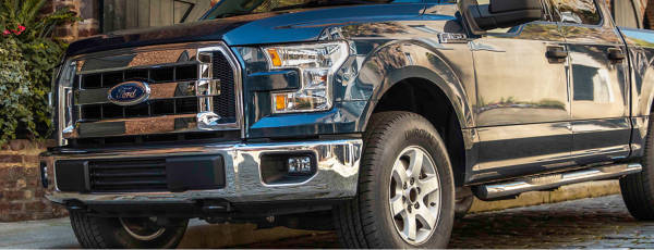SUV driving on rural highway featuring Uniroyal tires
